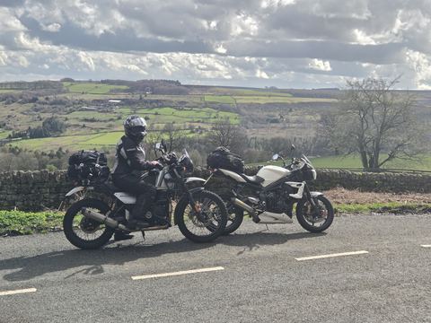 Two motorbikes parked on a country road, one of Becca's hobbies